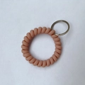 Elastic spiral coil keychain wristband in nude pink silicone with silver metal split ring - Pink