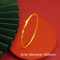 Polished golden geometric diamond cut bangle bracelet with 65mm inner diameter - 3*65mm