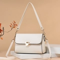 Creamy white pebbled leather crossbody bag with elegant gold buckle and dual straps - Off-white