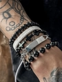 Close-up of men's layered beaded bracelets with a black cross and woven leather details - 5-Piece Multi-layered Cross Set (S1560)