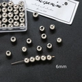 Vista detallada de cuentas espaciadoras de metal plateado 6mm para joyería DIY y nail art - Color Oro Blanco 6mm (20 piezas)