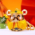 Cute God of Wealth keychain in gold metal with yellow enamel and sparkling rhinestones - Gold God of Wealth