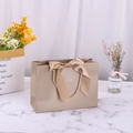 Champagne gold paper gift bag with a large satin bow and woven rope handles - 28*20*10cm / Champagne Gold + Champagne Ribbon