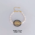 Détail d'un bracelet en perles avec médaille de la Vierge Marie, longueur 17+5cm et poids 14g - Médaille de la Vierge (B192) / Blanc