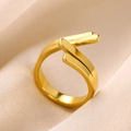 Minimalist double-layer crossover 18K gold stainless steel ring on beige fabric - Gold Double Row Cross