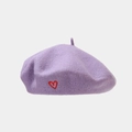 Detailed close-up of lavender wool beret featuring a delicate red embroidered heart - One Size / Light Purple