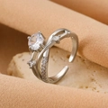 Silver layered bow ring with large clear zircon stone and adjustable open band design - Silver Intertwined Zirconia Ring (K-1067)