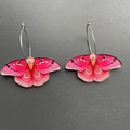 Detail of pink acrylic butterfly earrings with golden patterns and silver metal hoops - K52 Pink Moth