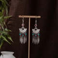 Detail of bohemian silver earrings with turquoise beads and ethnic tassel design - Red Blue and Silver (E1082)
