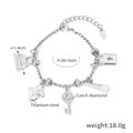 Bracciale con ciondoli in acciaio al titanio argento con orso, chiave a cuore e rossetto - Elementi di Moda Ciondolo / Colore Acciaio-E543