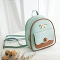 Mini mint green backpack with brown trim, golden bow detail and thin shoulder straps - Light Green