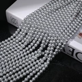 Macro shot of silver-grey round pearls with high metallic luster arranged in rows - 3mm (Approx. 240pcs/Strand) / 616 Linen Grey