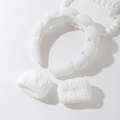 Detailed view of white fluffy spa headband and matching wristbands for face washing - White Headband And Wristbands Set
