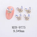 Macro view of 9.5x9mm butterfly nail charms with colorful rhinestones on pink nail - White Moonlight Gold Base Style (MZH-9775)