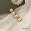 Retro gold hair clip with four large white pearls, length approx 6.0 cm, elegant style - Four Pearls Gold Edge