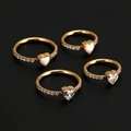 Detailed shot of golden stainless steel heart nose rings with opal and zircon gemstones - 4# Gold + Zirconia / 8mm