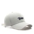 White cotton baseball cap with blue Vintage embroidery in a classic 45-degree side view - White