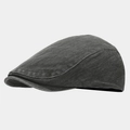 Detail view of charcoal gray washed denim newsboy cap showing twill texture and vintage finish - Gray