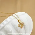 Golden titanium steel heart necklace with cubic zirconia stones on a white podium - No. 6 N0113 Gold