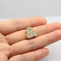 Close-up of a gold Mickey mouse shaped pendant charm with sparkling rhinestones for DIY - 10MM Gold Rhinestone-&