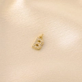 Close-up of a gold-plated letter B pendant with micro-pave white zircon crystals - Letter B / Gold