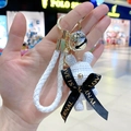 White woven resin rabbit keychain with gold bell and Love is Eternal ribbon strap - White Rabbit