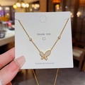 Elegant gold titanium butterfly necklace with white enamel inlay and small diamonds - X401 Gold Shell Butterfly