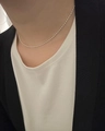 Close-up of minimalist silver sterling olive chain necklace on female model neck - Silver Olive Chain