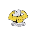Cartoon enamel pin featuring a muscular yellow bee with Bee Strong motivational text - Yellow Muscle Bee