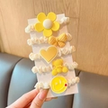 Close-up of 5-piece yellow themed scrunchie set with cute flower and heart resin charms - Yellow Series 5-Piece Set