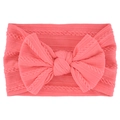 Soft coral pink cable knit baby headband with a large decorative knotted bow - Watermelon Red
