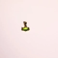 Gold marquise-cut necklace featuring an olive green birthstone on a pink background - August Pendant Only-Peridot Zirconia