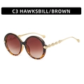 Chique oversized ronde zonnebril met schildpadmontuur, bruine glazen en gouden pootjes - Schildpad Frame Thee Lenzen