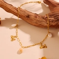 Golden stainless steel beach necklace featuring delicate crab and seashell charms on wood - Crab Shell Style (H704)