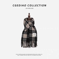Soft knitted scarf with black and beige plaid patterns and fringe details on mannequin - YF Plaid (Black Beige)