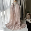 Pink striped wool scarf with fringe trim worn in a cozy natural light setting - Pink Striped Style