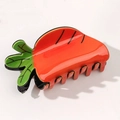Cute carrot-shaped hair claw clip in bright orange resin with green leaf detail - Carrot