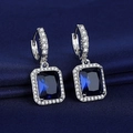 Silver drop earrings featuring rectangular dark blue gems and white crystal accents - Blue Diamond Earrings Led-112