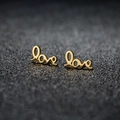 Elegant gold Love letter stud earrings with polished metallic finish on dark background - 128 Love / Rose Gold