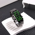 Detail of black metal link strap and green LED digital display on a lava style watch - Tungsten Black Green LED