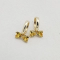 Golden bow earrings featuring heart-shaped yellow crystals with a sparkling design - Gold Base With Yellow Zirconia