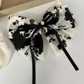Detail of floral chiffon bow hair tie with black ribbon and gold button accent - Spring Clips / 21# White Bow Spring Clip