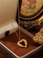 Close-up of golden heart pendant with wings inside a premium jewelry gift box - Zhn2404 Gold