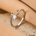 Polished silver ring featuring star-shaped cubic zirconia and micro-set round diamonds - Silver Star and Moon Zirconia Ring (WG-104)