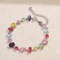Detailed shot of multi-colored zircon bracelet with various crystal cuts and lobster clasp - Bracelet / White Gold
