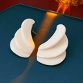 Modern white resin layered wave stud earrings with golden finish and silver needles - Milky White Layered Wavy
