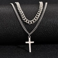 Double-layered silver Cuban chain necklace with cross pendant on black background - Cross Pendant Style / Silver