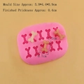Stampo in silicone rosa con 10 mini forme a osso per fondente, cioccolato e dolci - Osso a 10 Cavità (8722) / Rosa