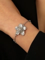 Silver flower pendant bracelet with textured petals and delicate metal chain on wrist - Silver Flower Bracelet (10193)