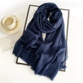 Detail of navy cotton linen scarf with frayed edges on an artistic white frame - Navy Blue
